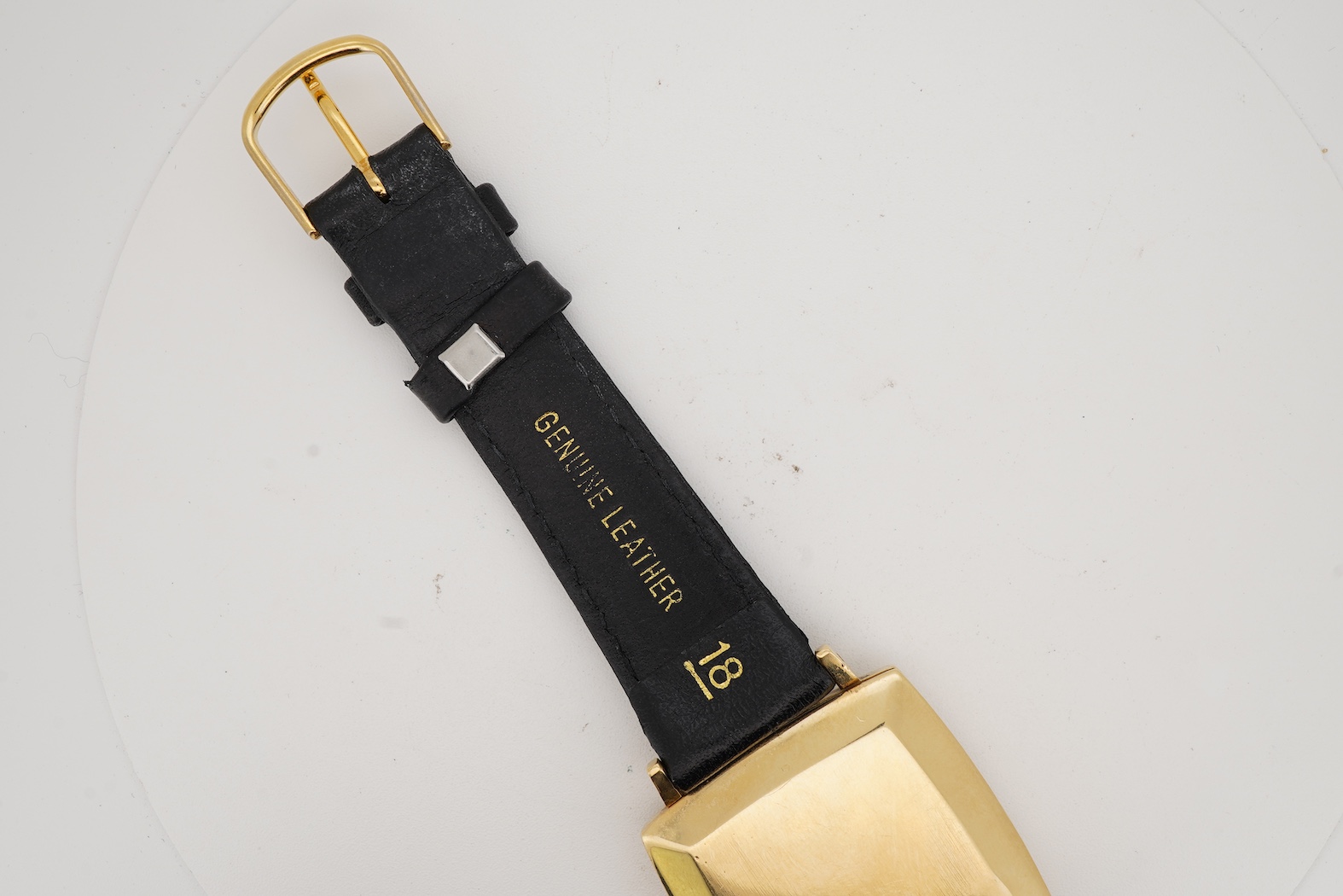 A gentleman's 18ct gold Eterna-Matic 3000 wrist watch, with baton hour marker, centre seconds hand and calendar aperture at 3 o’clock, on an associated black leather strap